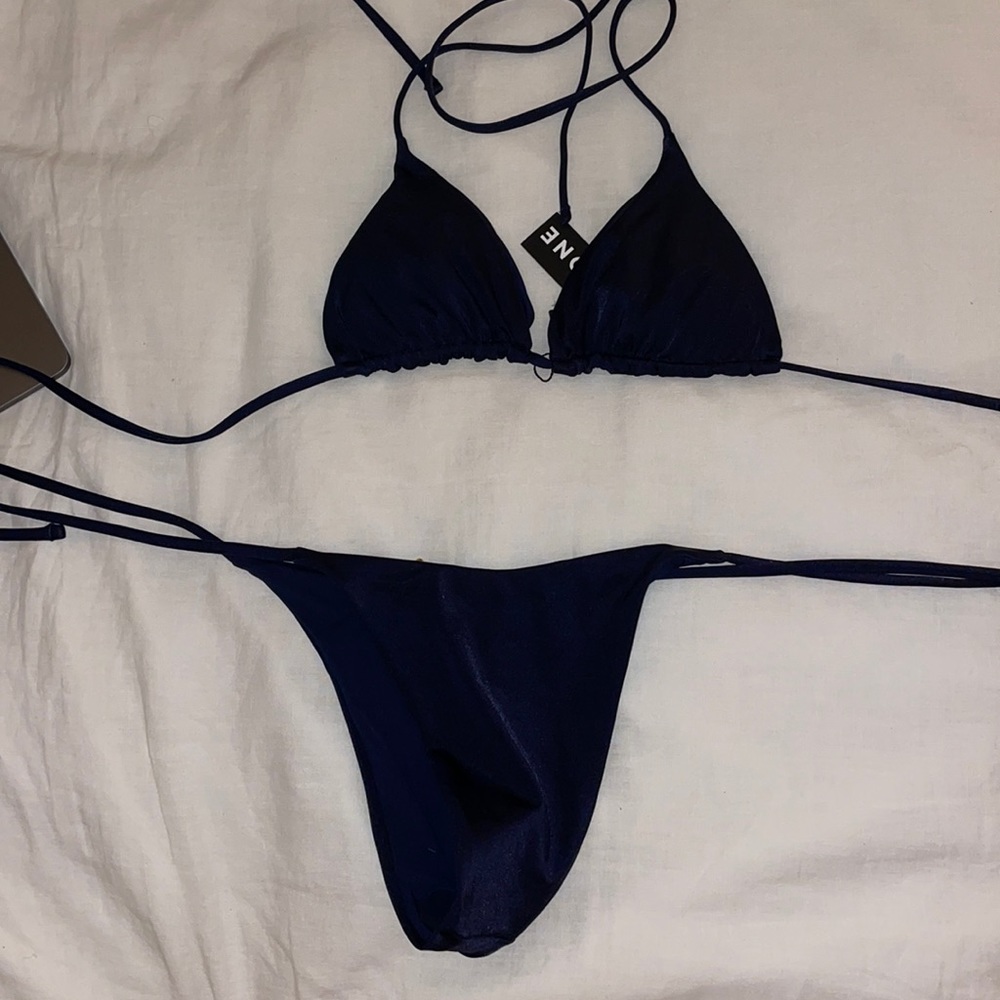OneOne brand new navy triangle bikini. Tags on! Never worn.